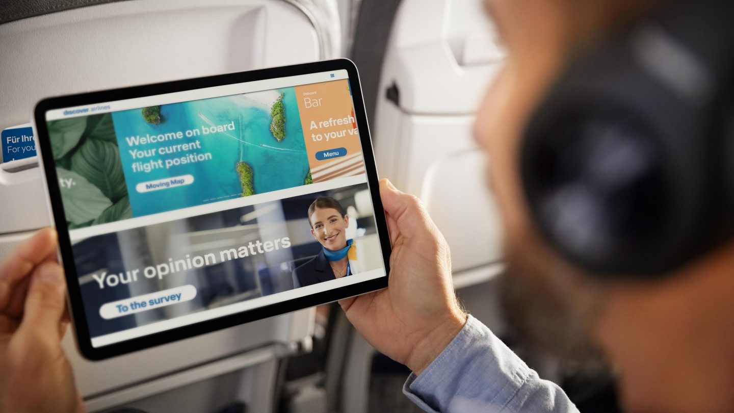 A man looks at the Onboard Cloud on his tablet
