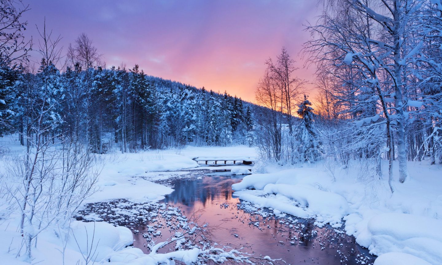 Snowy landscape at sunset in Kittilä, Finland