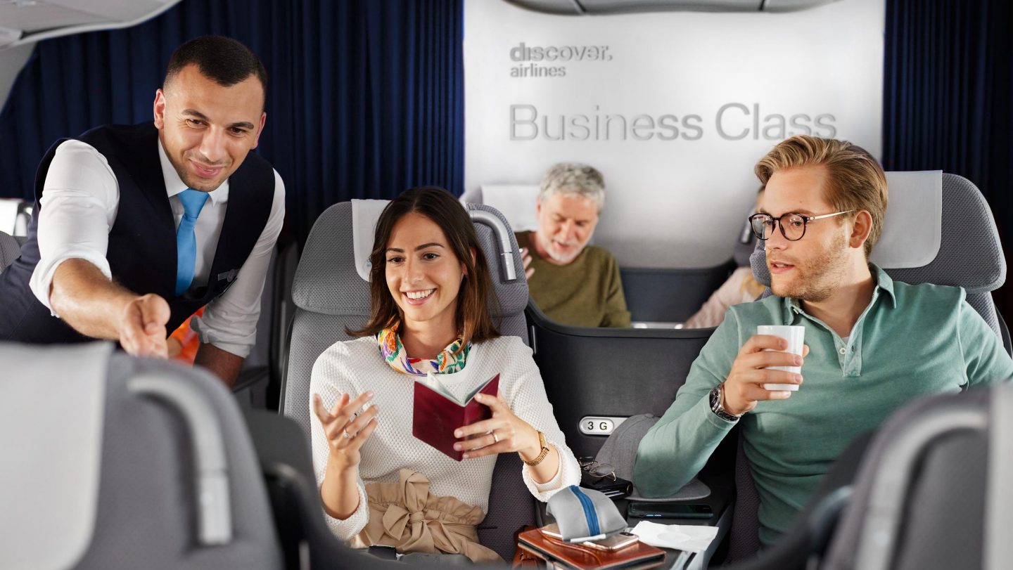 Special requests Flight attendant showing passengers on board the offer