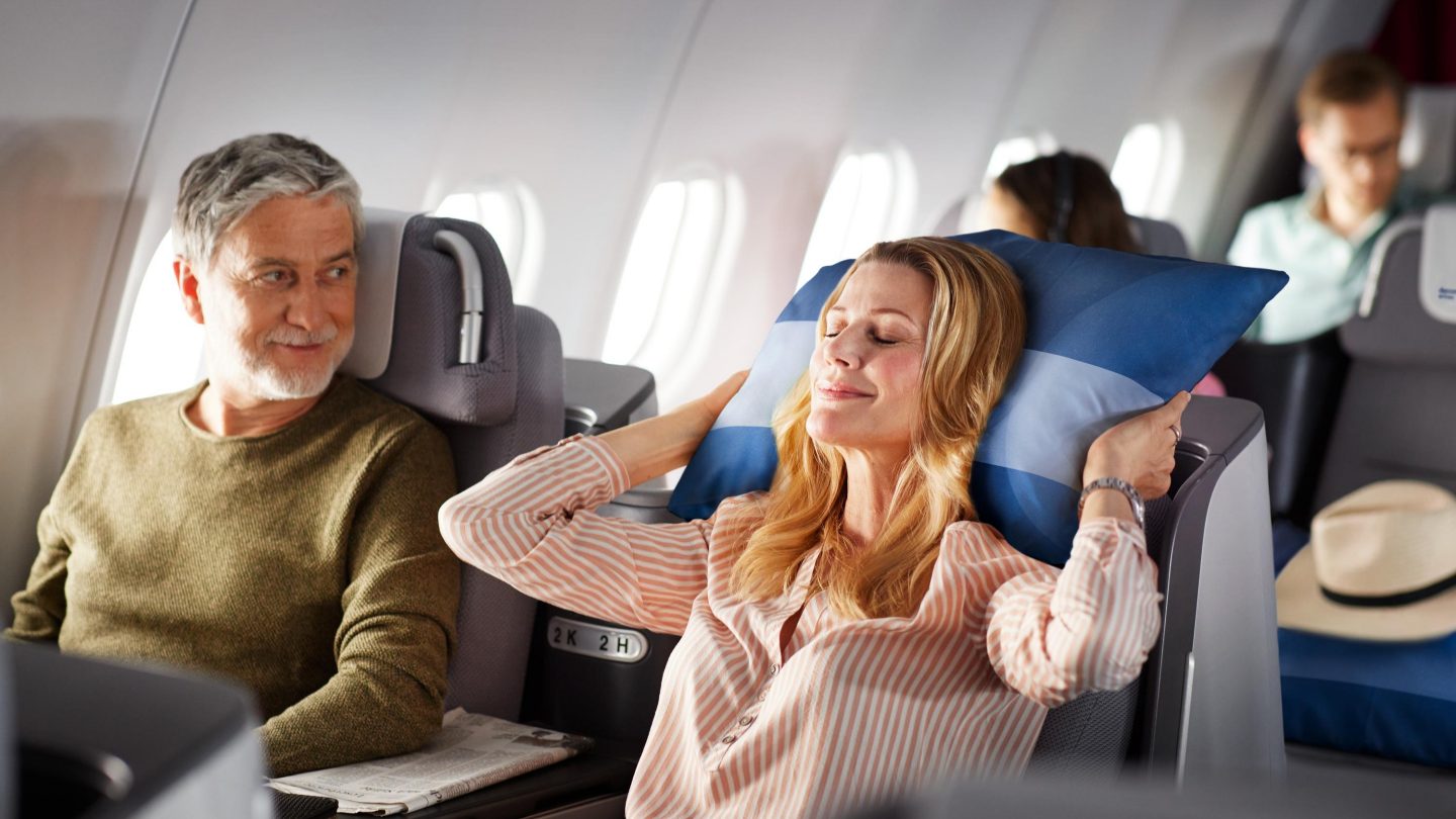 Two people sitting in Business Class