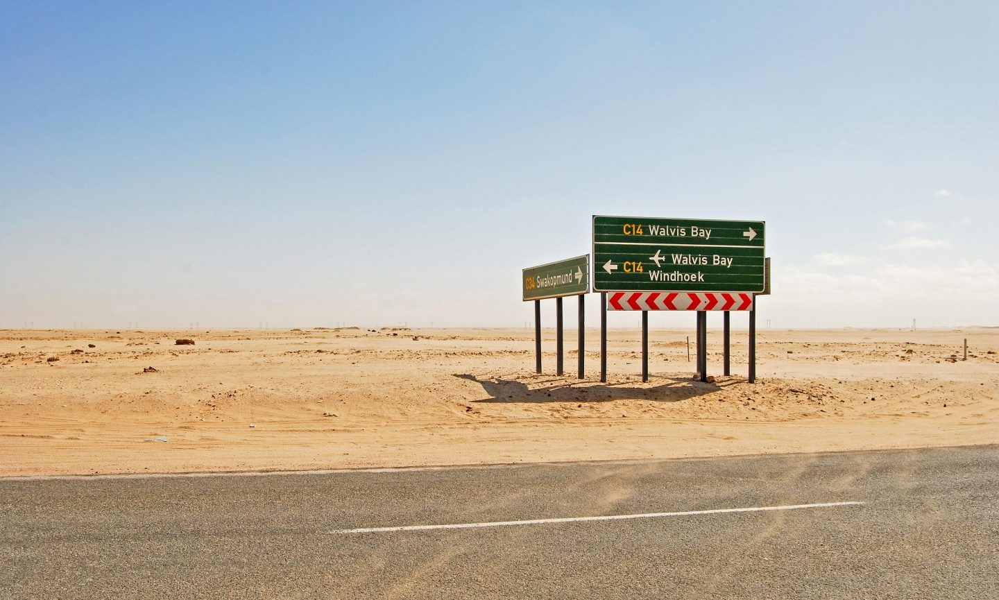 Road signs in the desert on the road to Windhoek Road signs in the desert on the road to Windhoek