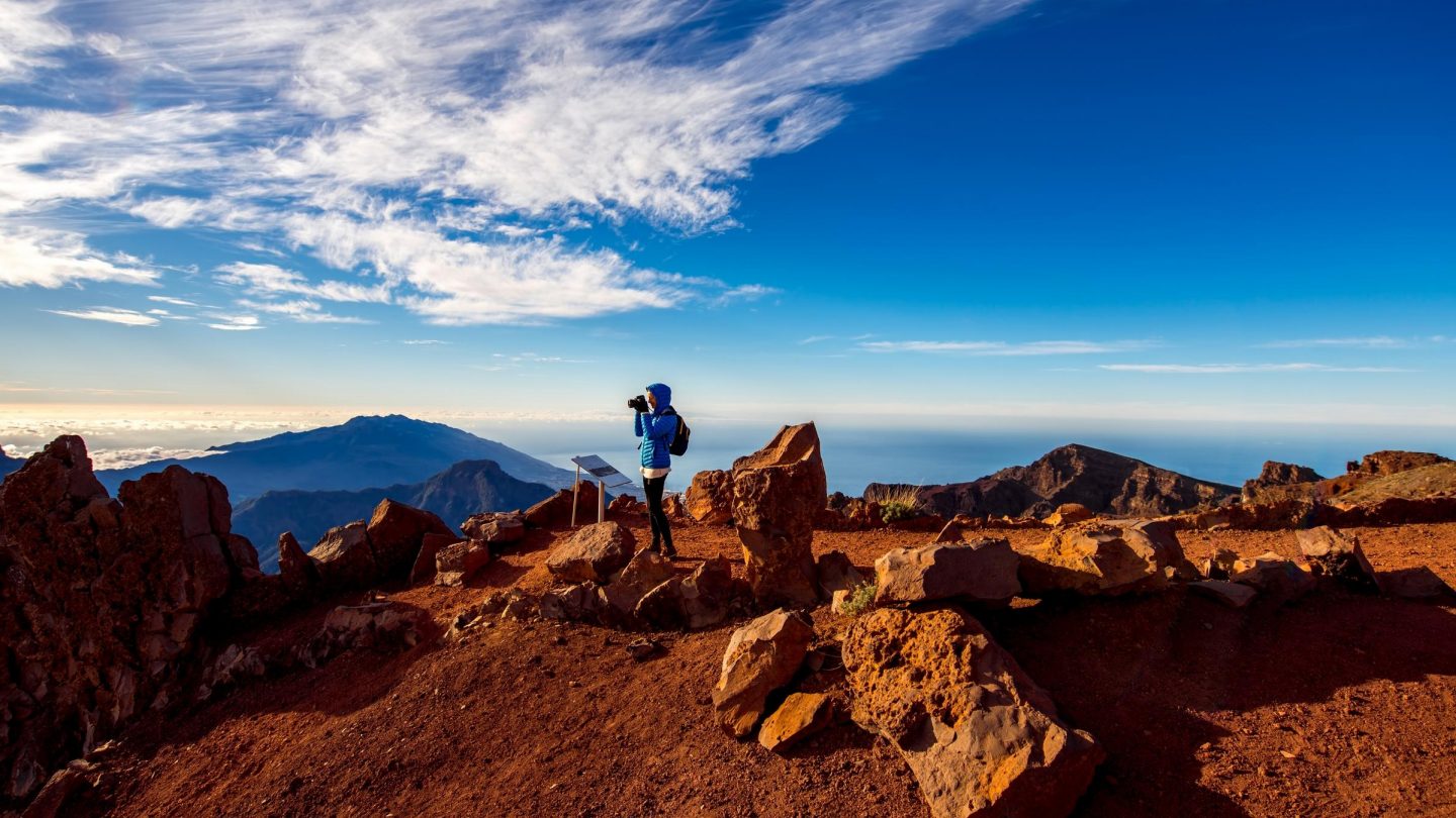 Mountain panorama with a person in the center of the picture