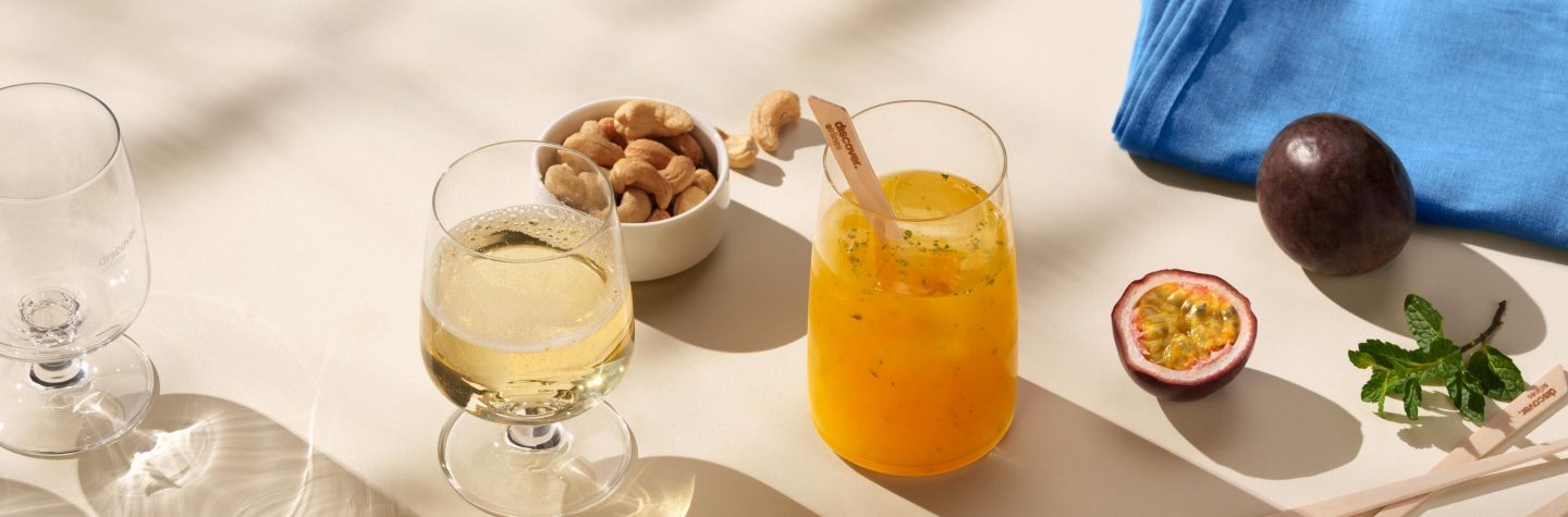 Business Class intercontinental service Champagne and bay cocktail with nuts