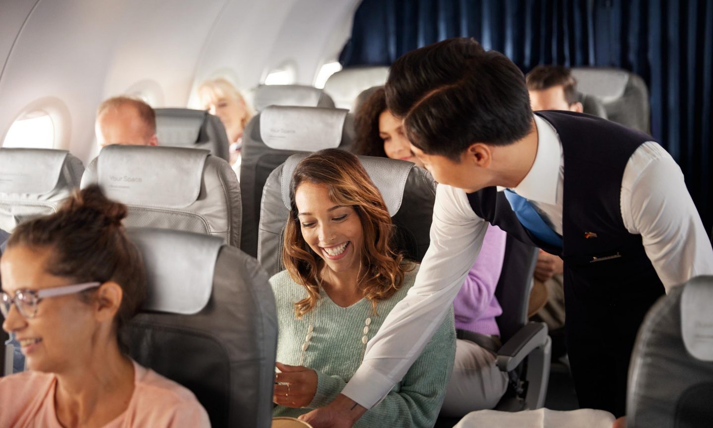 Special meals in short range Business Class Passenger is given a special meal by the flight attendant