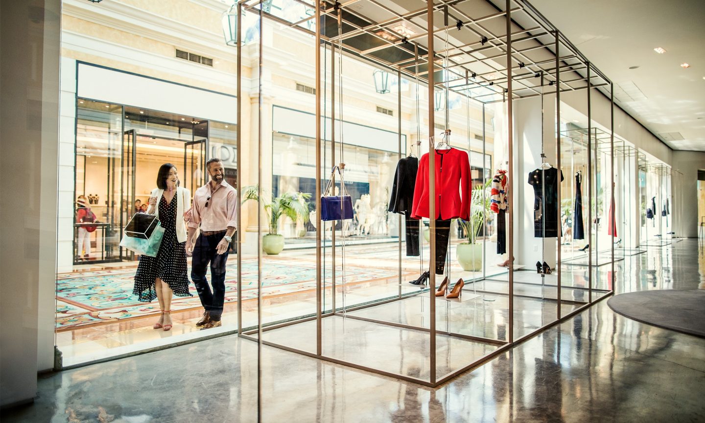 Man and woman shopping for clothes