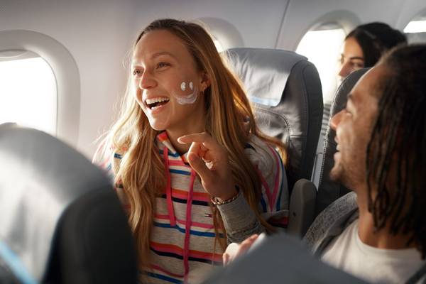 Couple laughing in the airplane